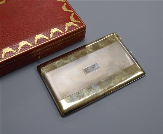 A Cartier gilt white metal and 14k yellow metal cigarette case, with engraved initials, signed and numbered 3755, 13cm.